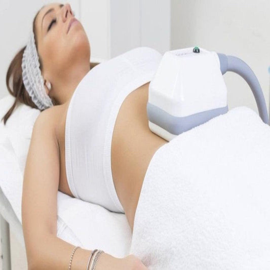Cryolypolysis Training  session showcasing technician applying fat-freezing applicator to client’s abdomen to target stubborn fat.