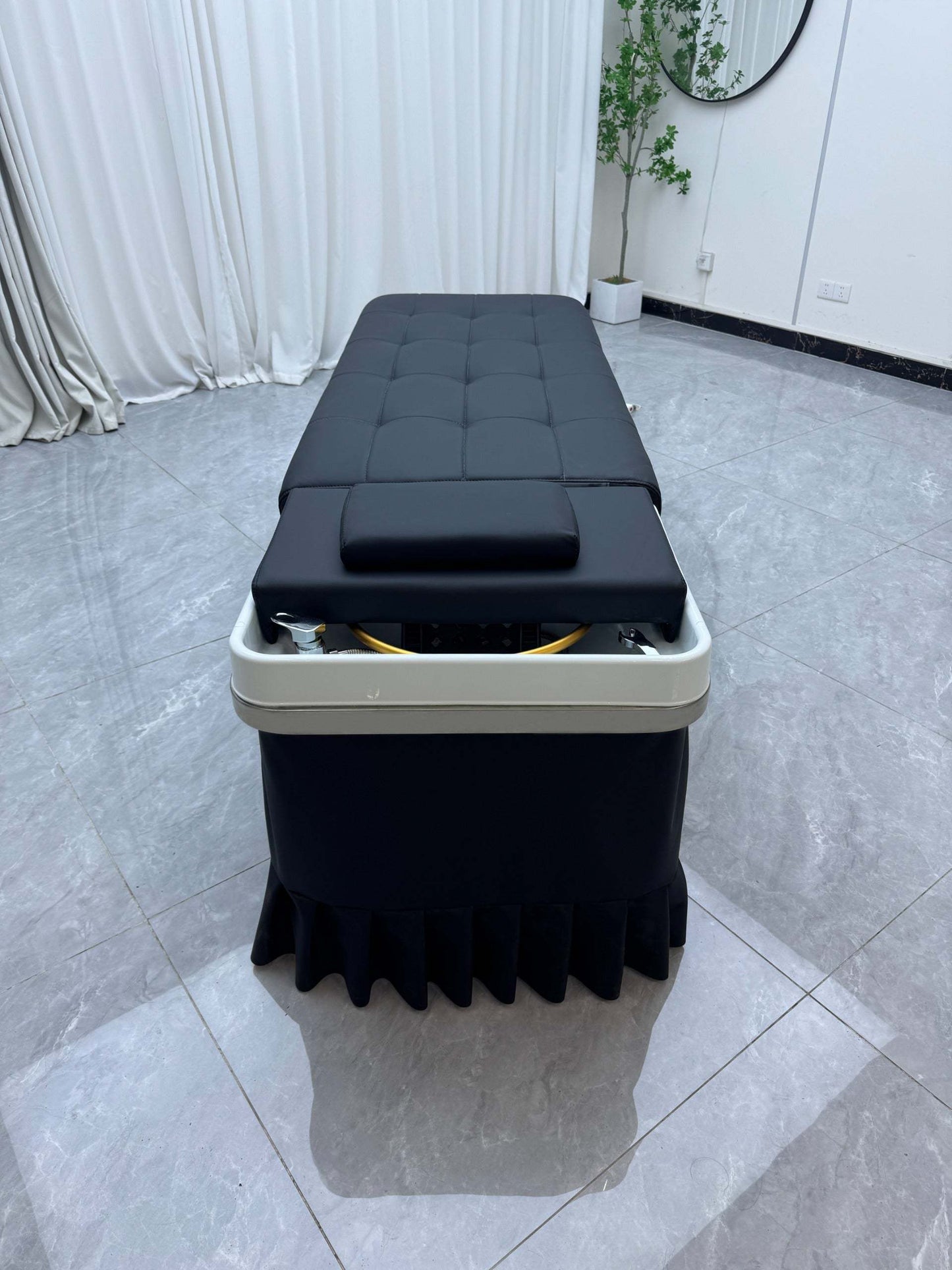 Close-up of ergonomic features on the Japanese Scalp Massage Bed for wellness experiences.
