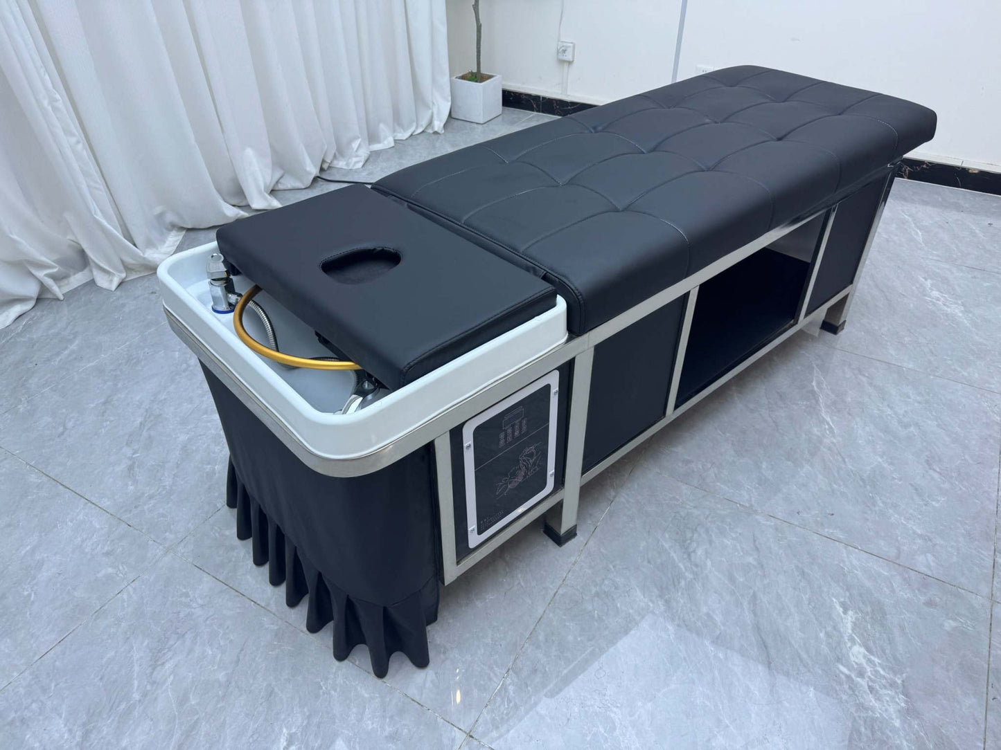 Client enjoying a rejuvenating treatment on a Japanese Scalp Massage Bed in a luxury spa environment.