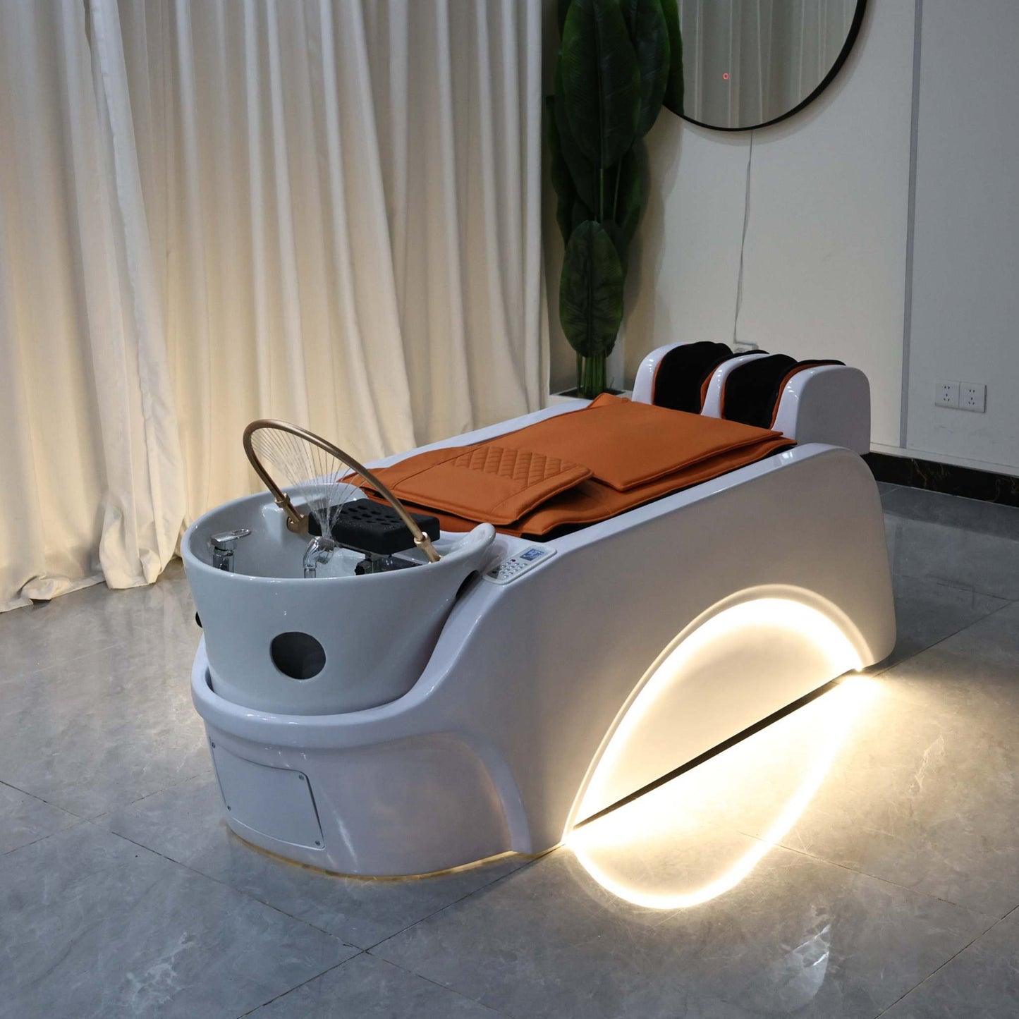 Innovative spa bed for scalp therapy with ergonomic curves and luxury detailing.