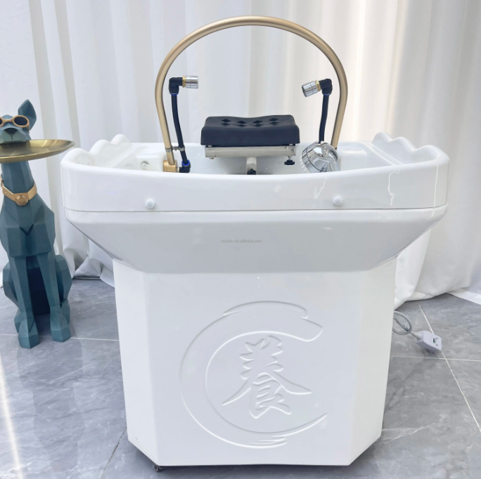 Client relaxing during treatment with Scalp Massage Sink – Non-Plumbed with Tank, highlighting ergonomic bowl design and comfort.