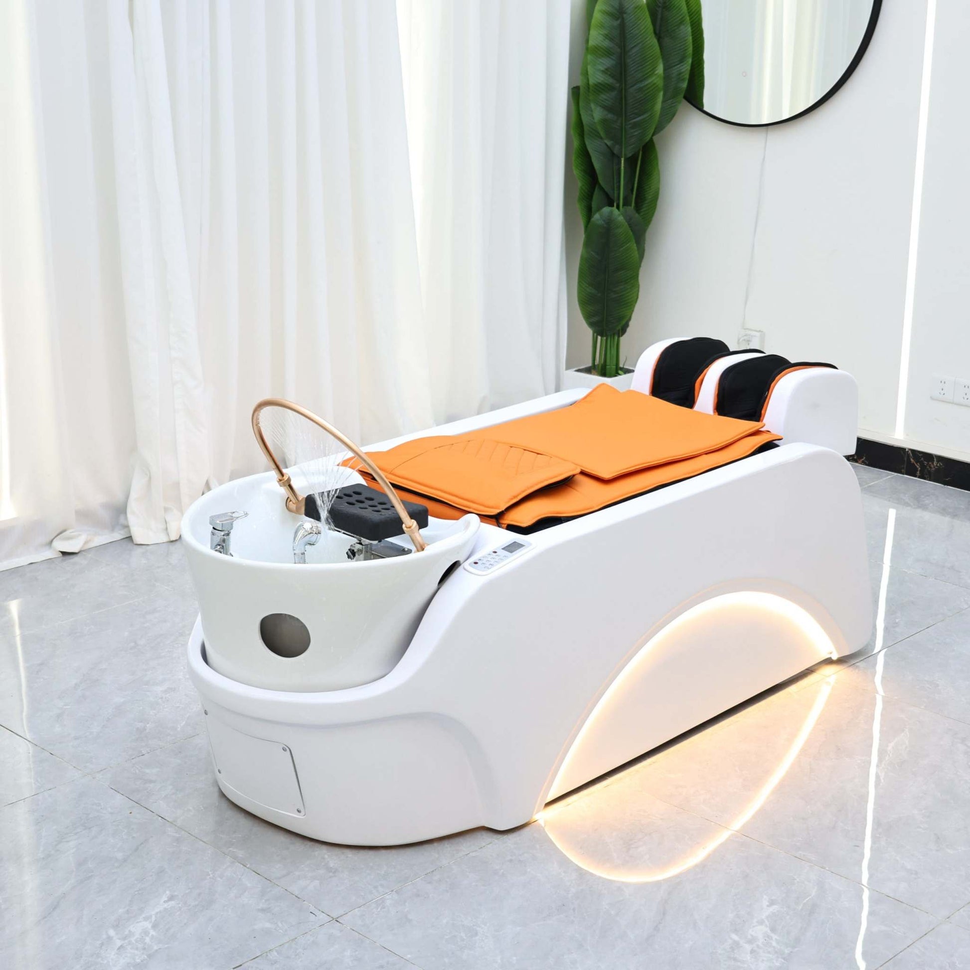 Modern scalp therapy bed with LED accents, designed for professional beauty treatments.