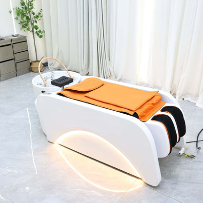Advanced beauty spa equipment with a transparent dome and cushioned orange bedding.